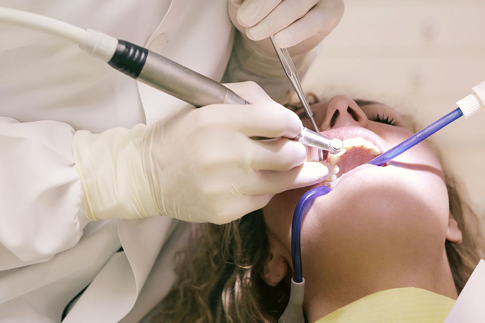 man getting his teeth examined